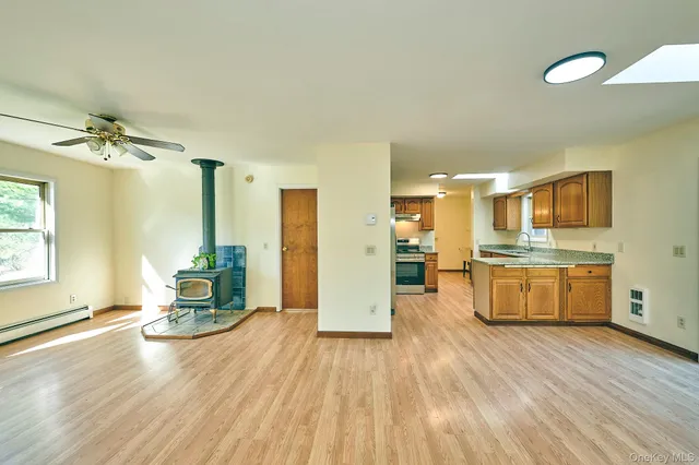 an empty room with a empty space and windows