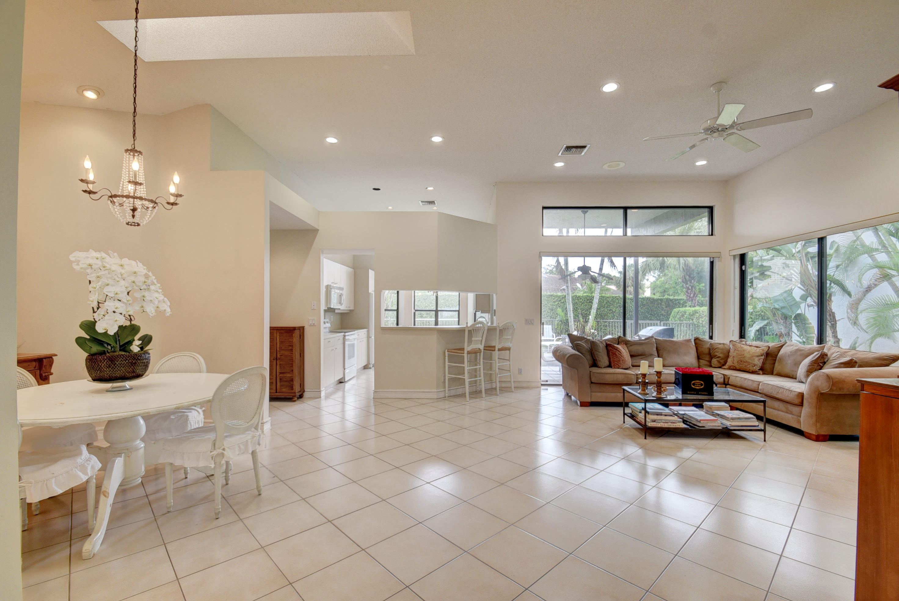 4426 Northwest 29th Way Boca Raton, FL 33434 - Photo 2 of 23 a living room with furniture large window and glass door