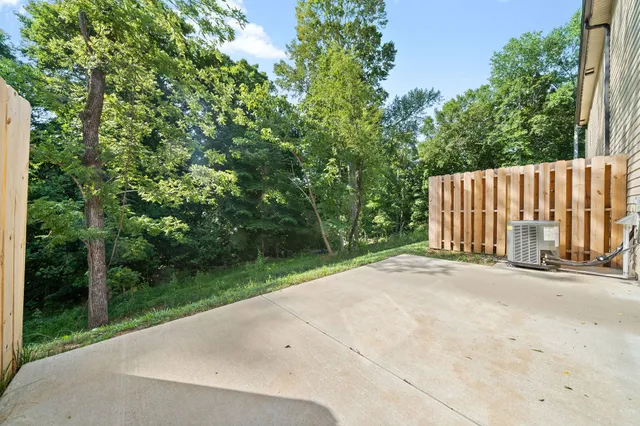 a view of a street with a trees