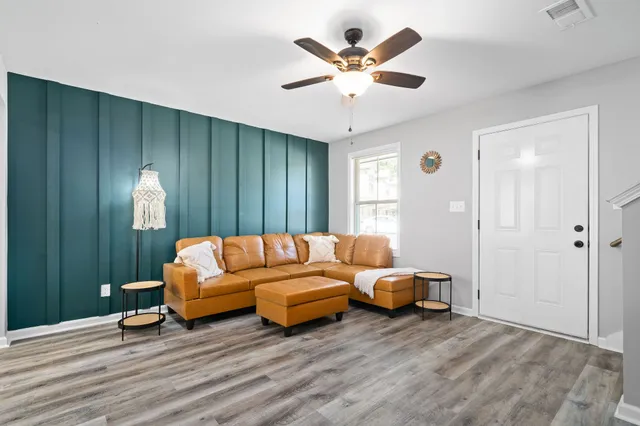 a living room with furniture and a large window