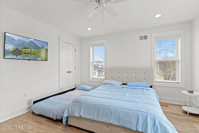 a bathroom with a sink toilet and window