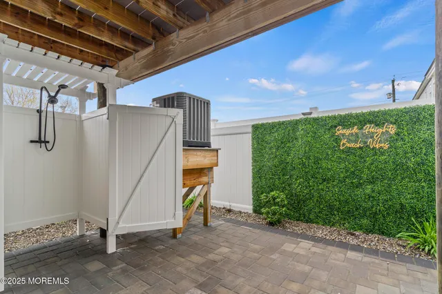 a living room with furniture and a painting on the wall