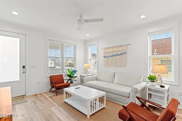 a living room with furniture and a work place