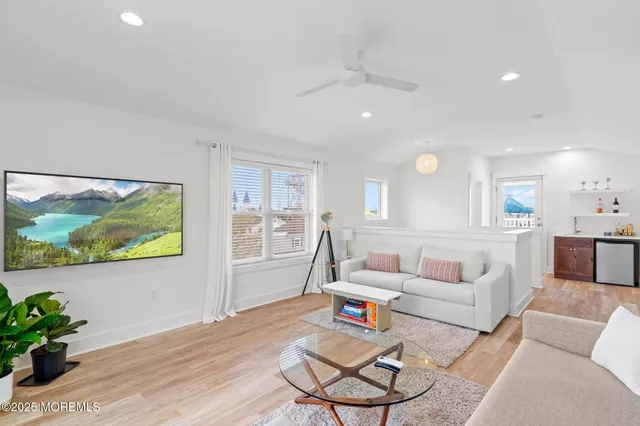 a kitchen with stainless steel appliances granite countertop a sink a stove a refrigerator and cabinets