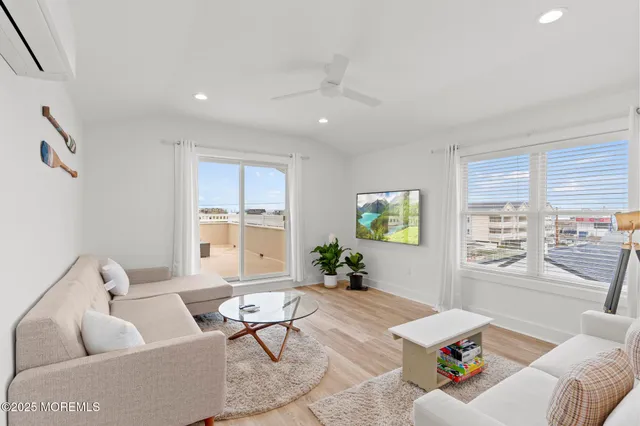 a view of roof deck with two chairs and wooden floor