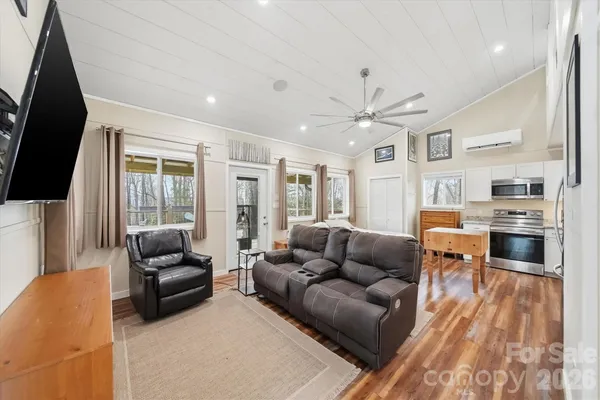 a living room with furniture and a flat screen tv