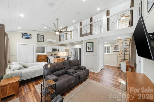 a living room with furniture and a flat screen tv