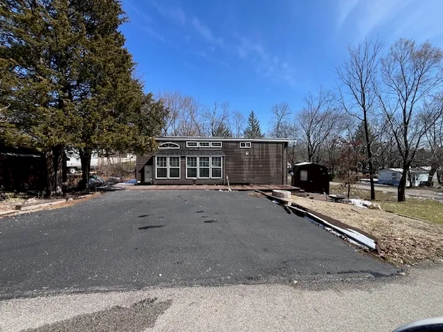 a view of a street with a building in the background