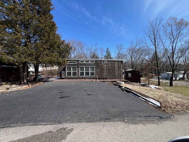 a view of a street with a building in the background