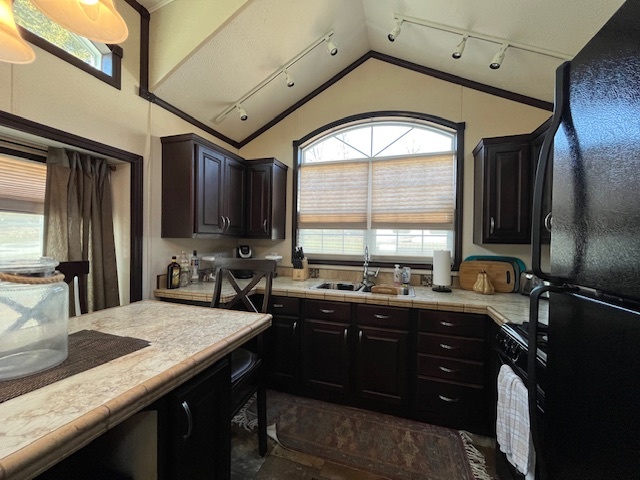 2795 East 28th Road Marseilles, IL 61341 - Photo 5 of 60 a kitchen with a sink stove and refrigerator