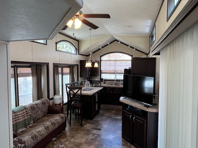 2795 East 28th Road Marseilles, IL 61341 - Photo 7 of 60 a living room with furniture a flat screen tv and a large window
