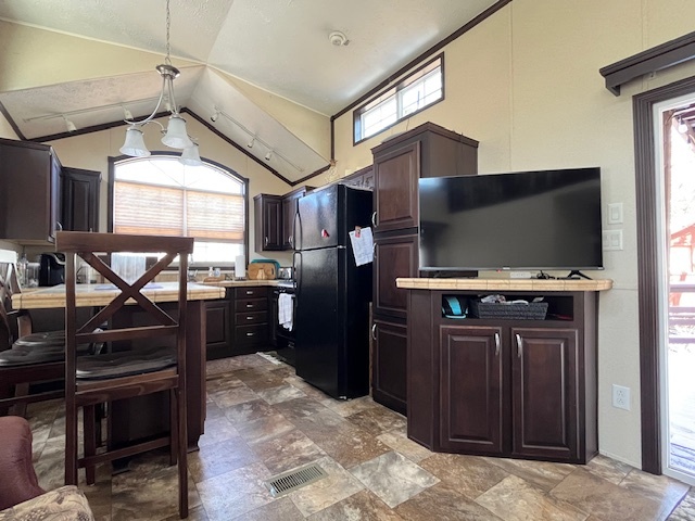 2795 East 28th Road Marseilles, IL 61341 - Photo 10 of 60 a kitchen with stainless steel appliances kitchen island granite countertop a refrigerator and a sink