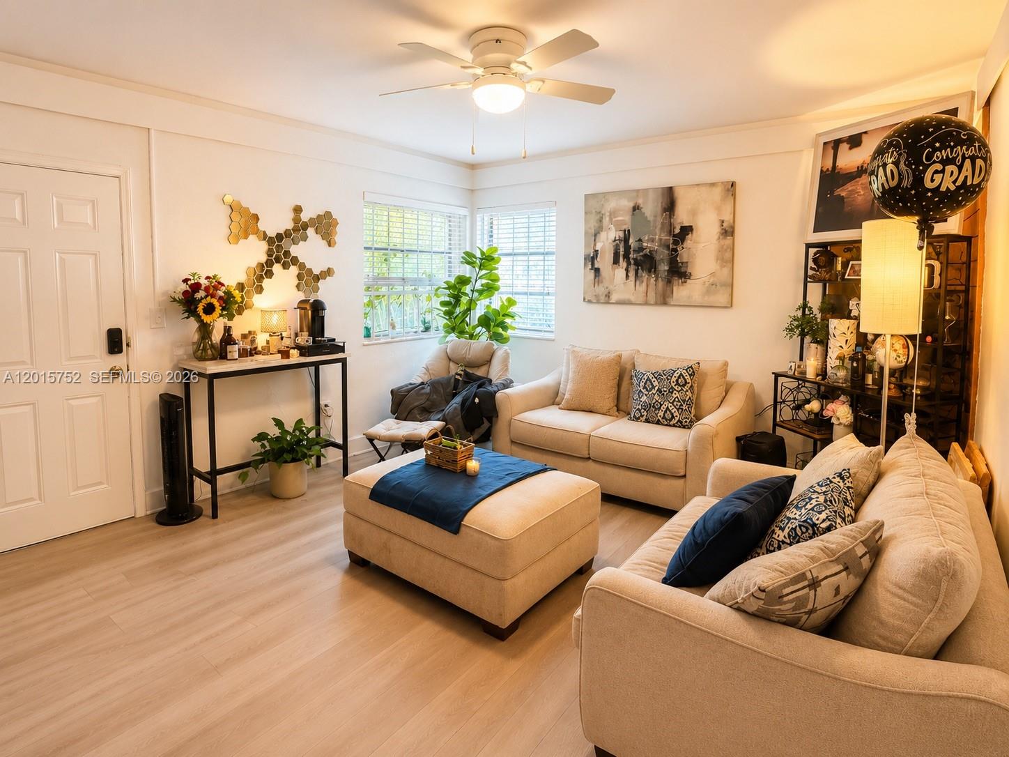 8144 Harding Avenue, Unit 2 Miami Beach, FL 33141 - Photo 1 of 18 a living room with furniture and flowers