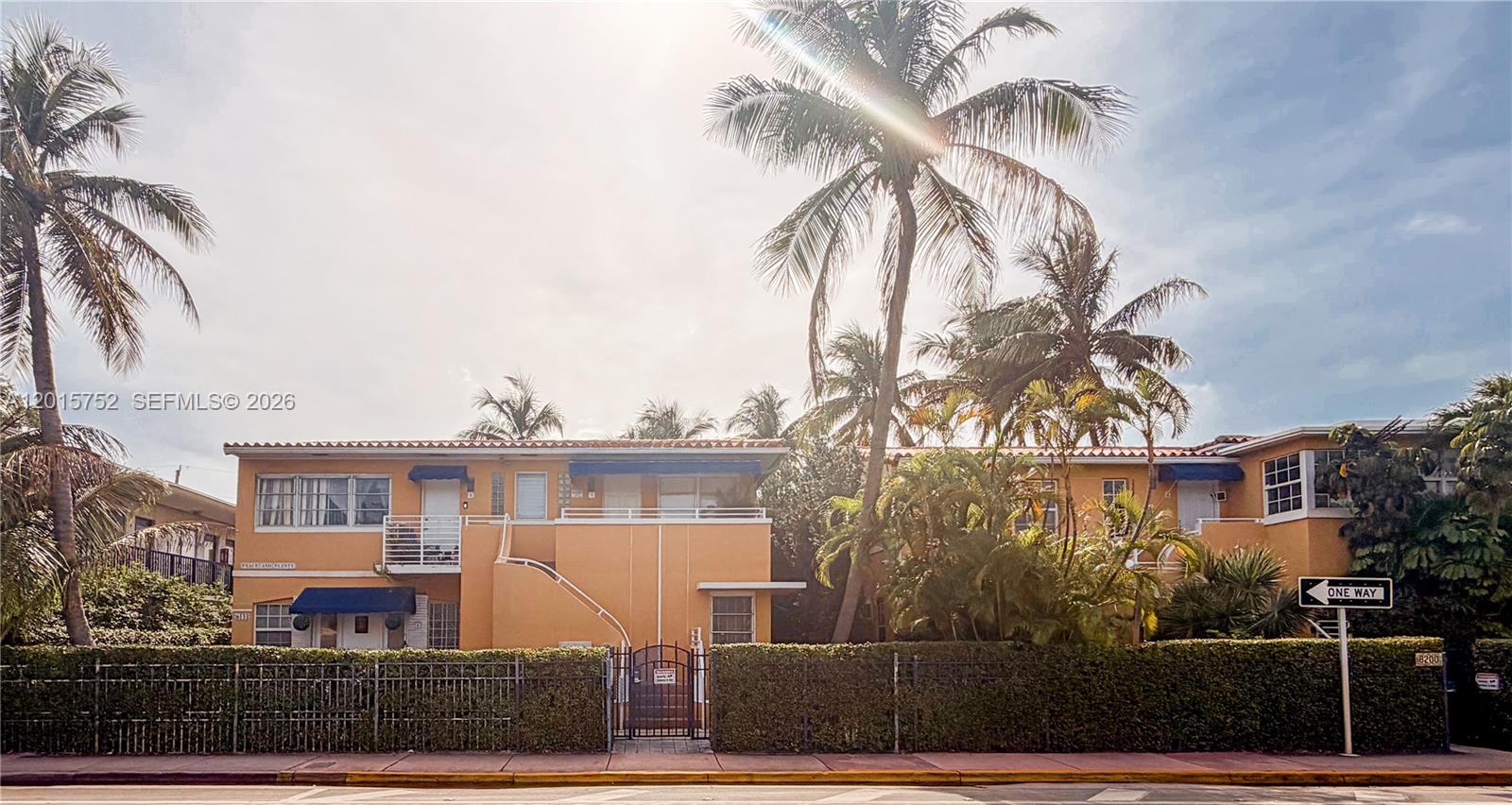 8144 Harding Avenue, Unit 2 Miami Beach, FL 33141 - Photo 12 of 18 a front view of a house with a yard and garage