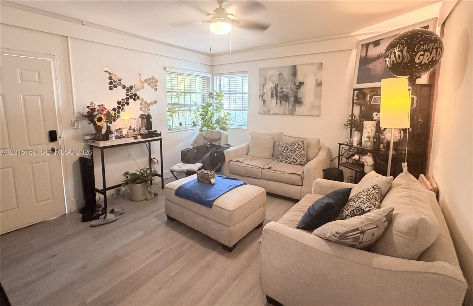 8144 Harding Avenue, Unit 2 Miami Beach, FL 33141 - Photo 3 of 18 a living room with furniture and a large window