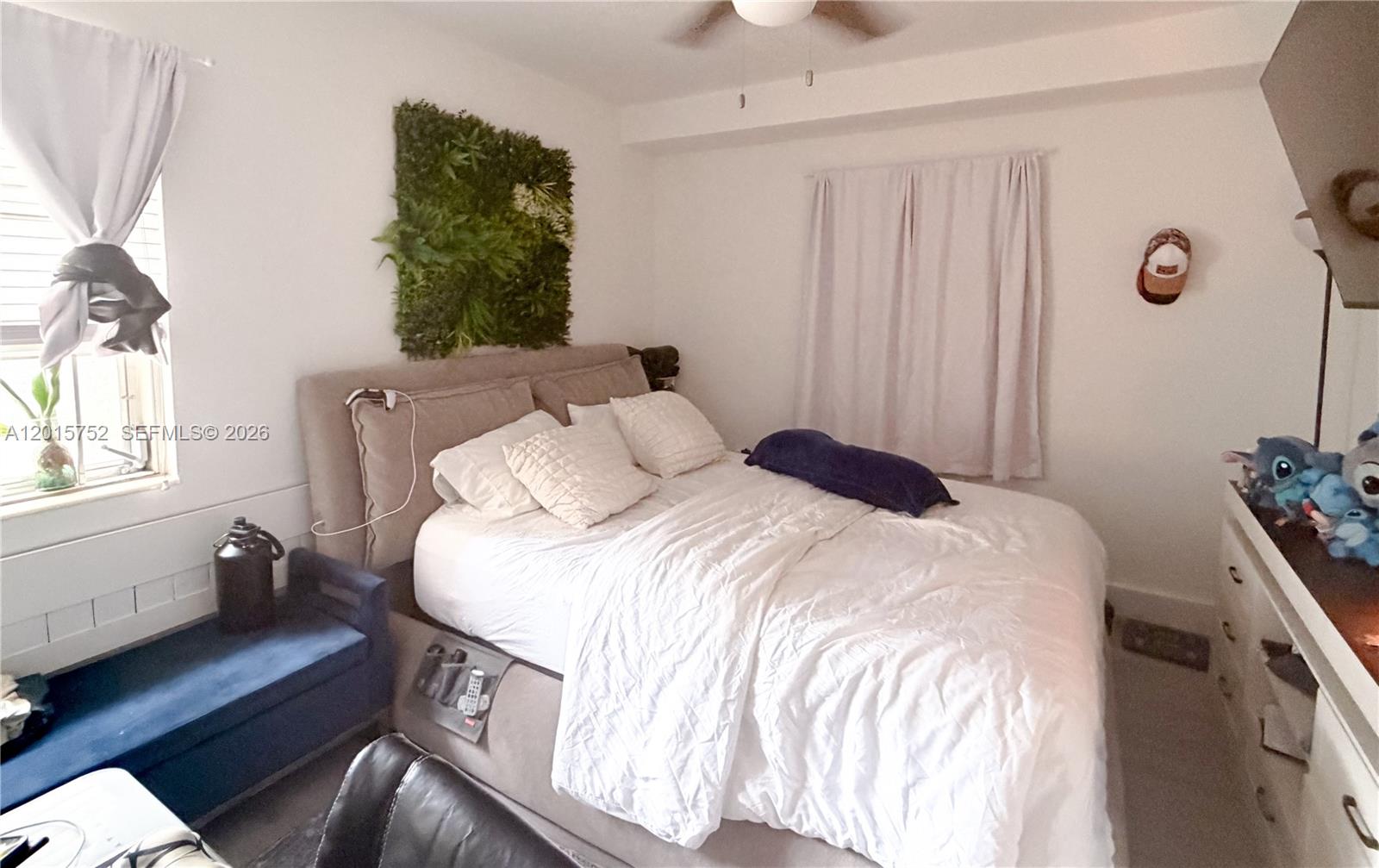 8144 Harding Avenue, Unit 2 Miami Beach, FL 33141 - Photo 5 of 18 a bedroom with a bed and a window