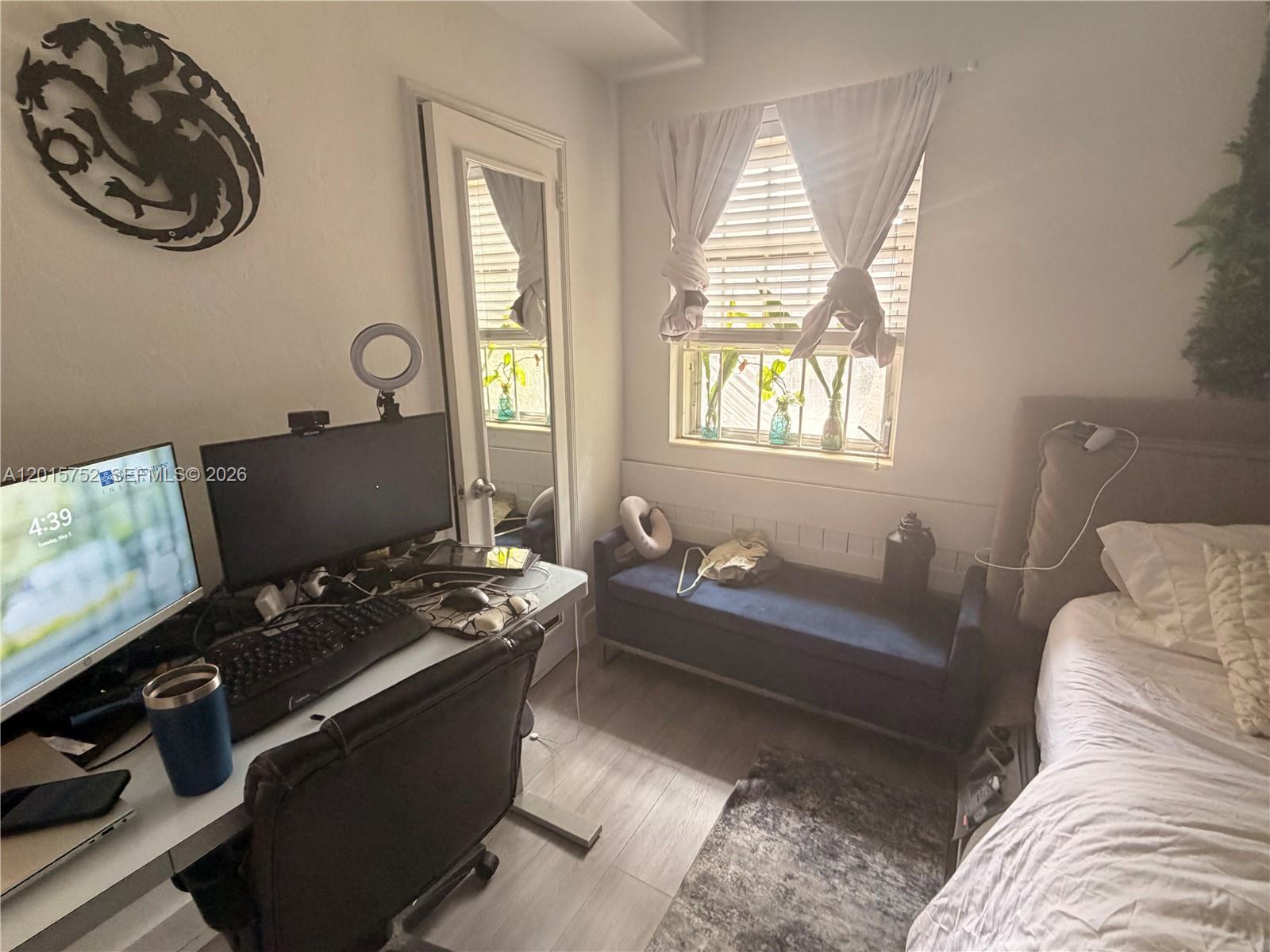 8144 Harding Avenue, Unit 2 Miami Beach, FL 33141 - Photo 6 of 18 a living room with furniture and a window