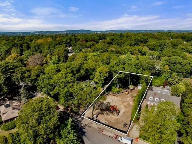 a view of a backyard with wooden floor and a garden