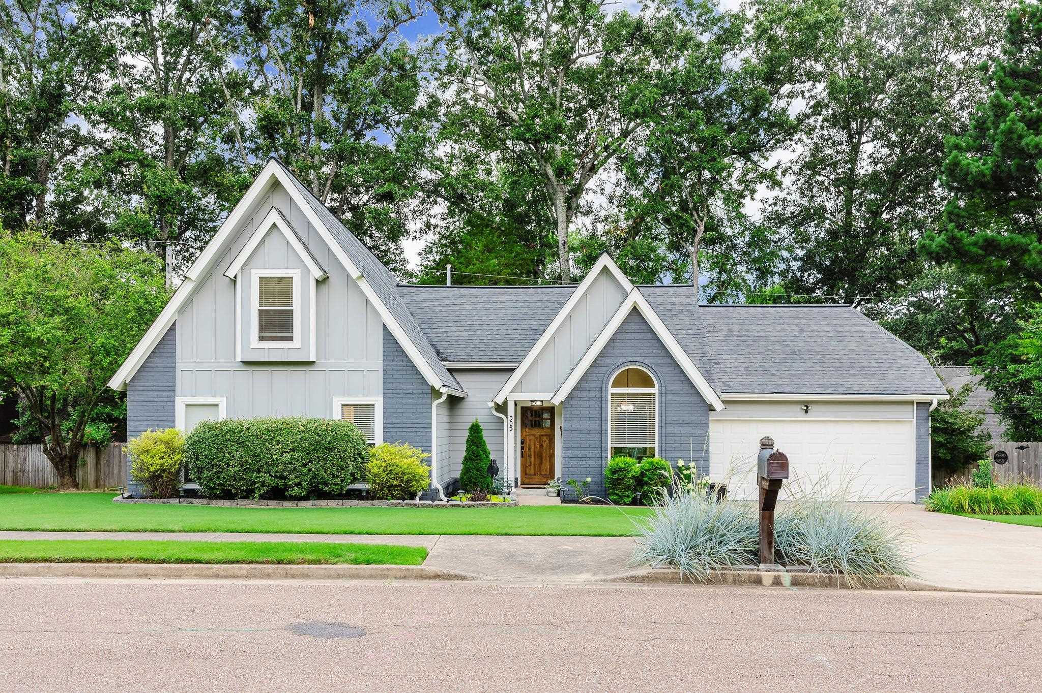 305 Great Falls Road Collierville, TN 38017 - Photo 2 of 23 Gray-painted brick and light gray siding exterior with a dark asphalt shingle roof