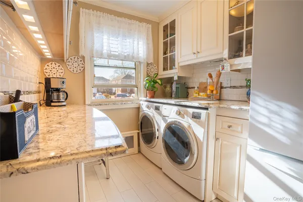 a kitchen with stainless steel appliances granite countertop a sink and cabinets