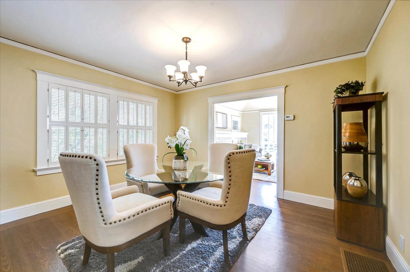 22 Engle Road San Mateo, CA 94402 - Photo 11 of 42 a view of a dining room with furniture wooden floor and chandelier
