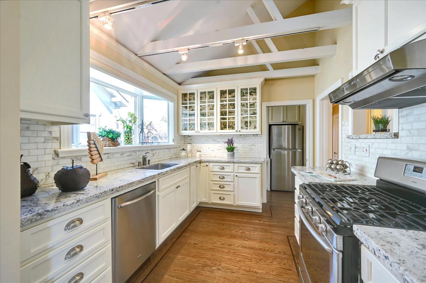 22 Engle Road San Mateo, CA 94402 - Photo 13 of 42 a kitchen with a stove a sink and a refrigerator