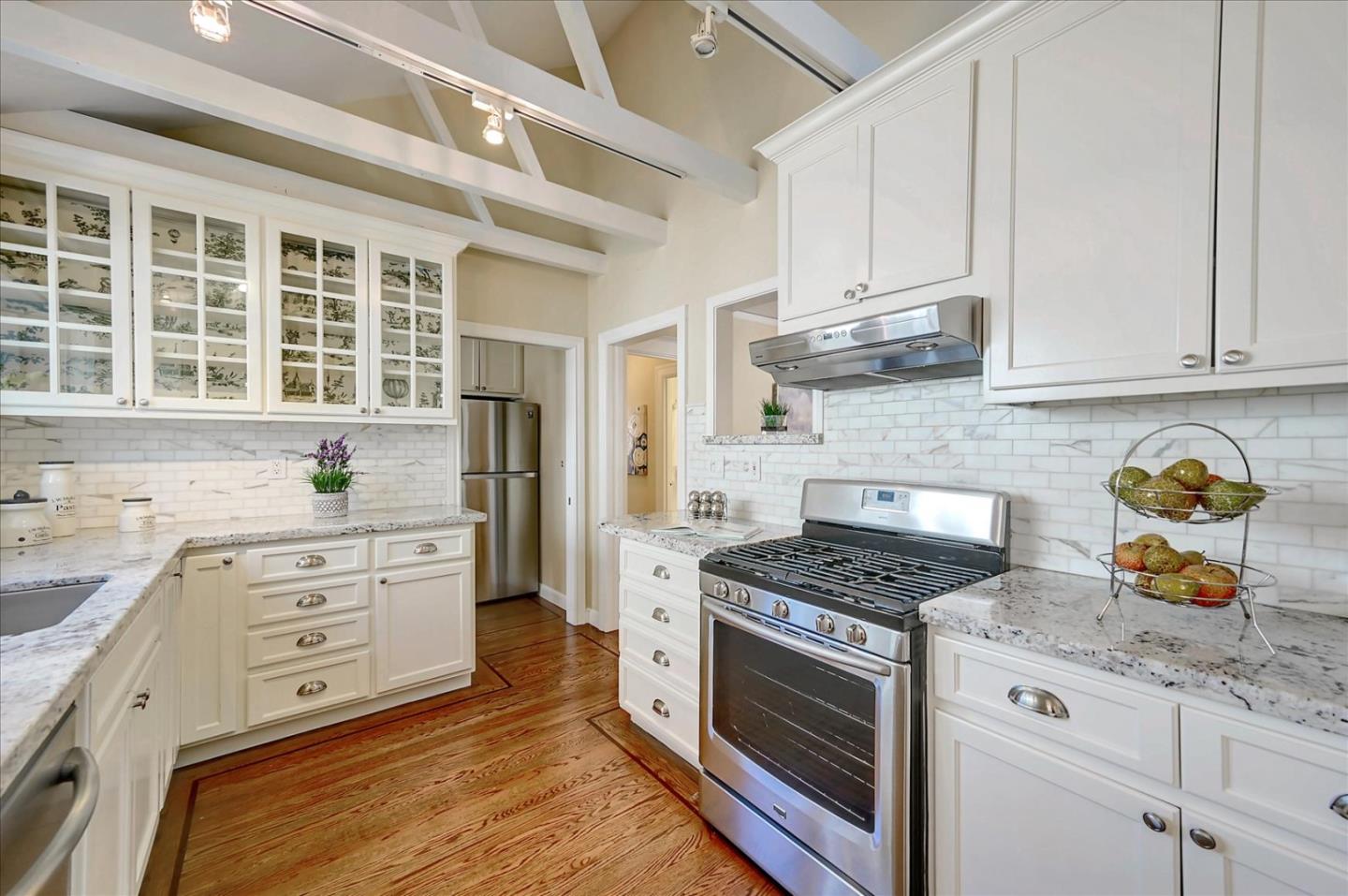 22 Engle Road San Mateo, CA 94402 - Photo 14 of 42 a kitchen with granite countertop a stove a sink and a refrigerator