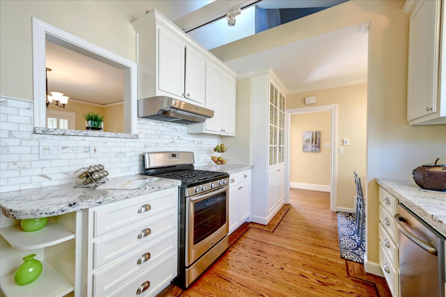 22 Engle Road San Mateo, CA 94402 - Photo 15 of 42 a kitchen with a stove and a wooden floor