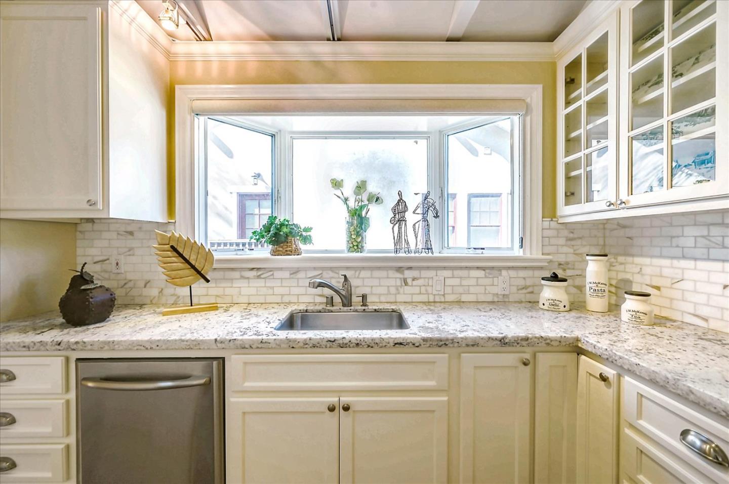22 Engle Road San Mateo, CA 94402 - Photo 16 of 42 a kitchen with granite countertop a sink and a window
