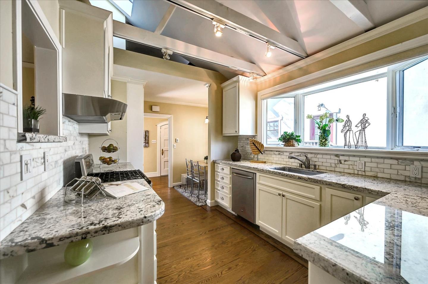 22 Engle Road San Mateo, CA 94402 - Photo 17 of 42 a kitchen with stainless steel appliances granite countertop sink stove and cabinets