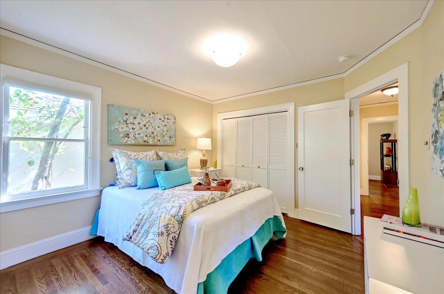 22 Engle Road San Mateo, CA 94402 - Photo 19 of 42 a bedroom with a bed and a large window