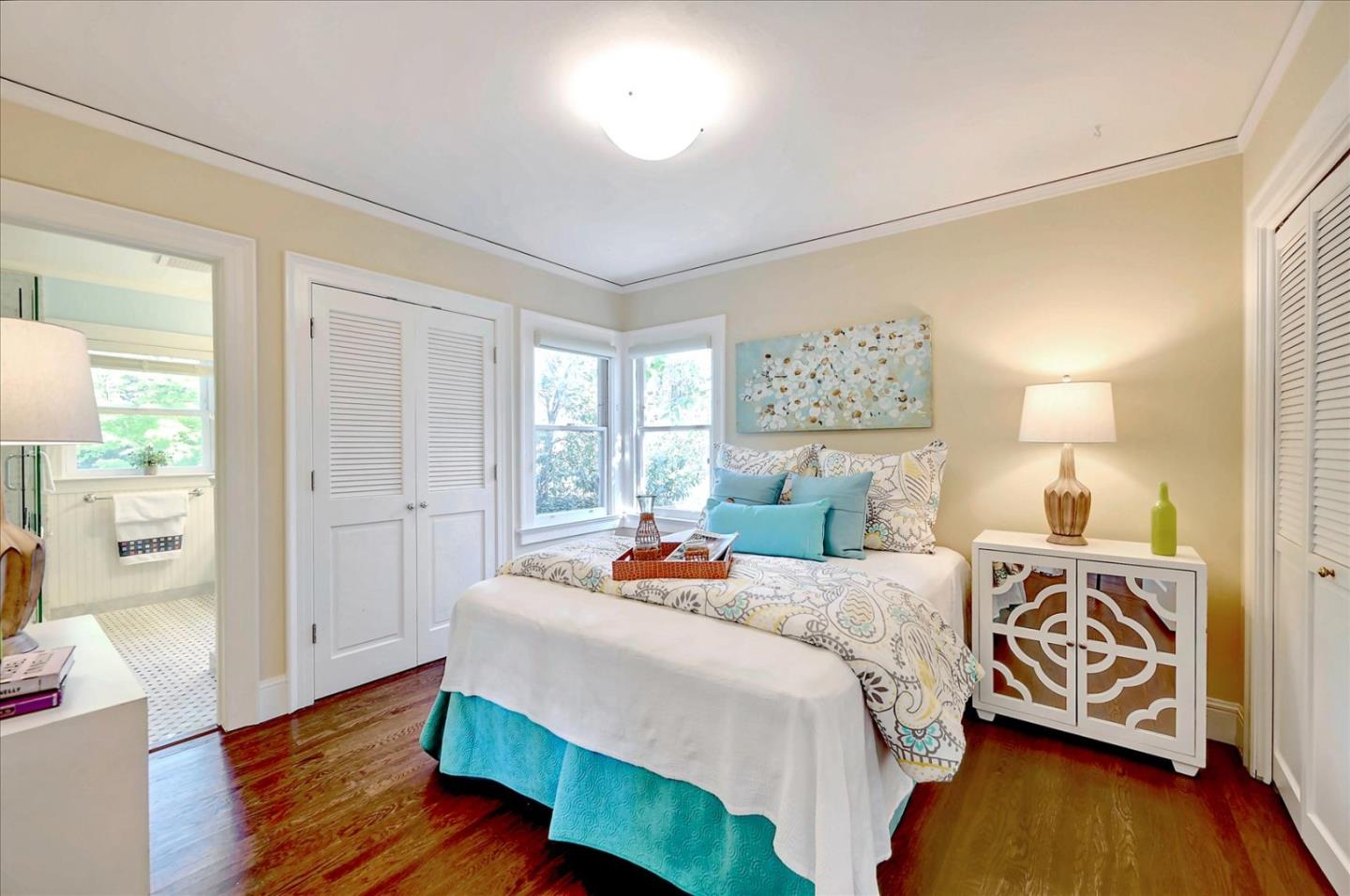 22 Engle Road San Mateo, CA 94402 - Photo 20 of 42 a bedroom with a bed and wooden floor