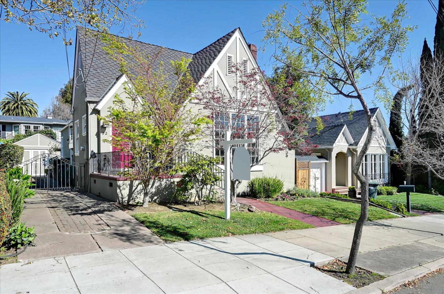 22 Engle Road San Mateo, CA 94402 - Photo 3 of 42 a view of a white house next to a yard with potted plants