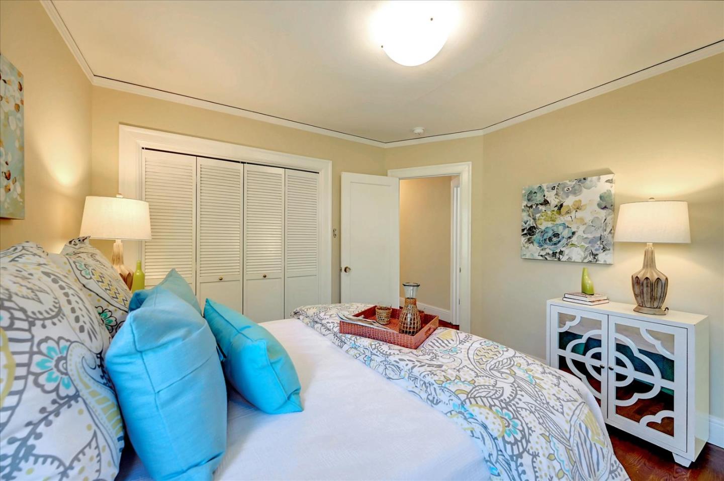 22 Engle Road San Mateo, CA 94402 - Photo 21 of 42 a bedroom with a bed and a lamp on the dresser