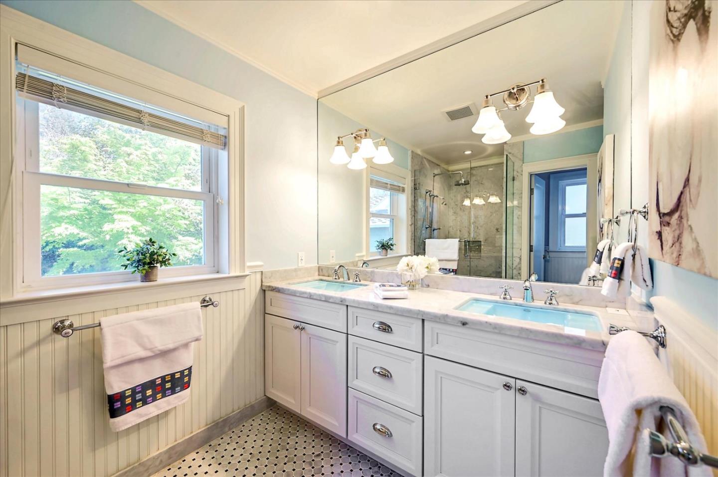 22 Engle Road San Mateo, CA 94402 - Photo 22 of 42 a bathroom with a sink a vanity and a large mirror