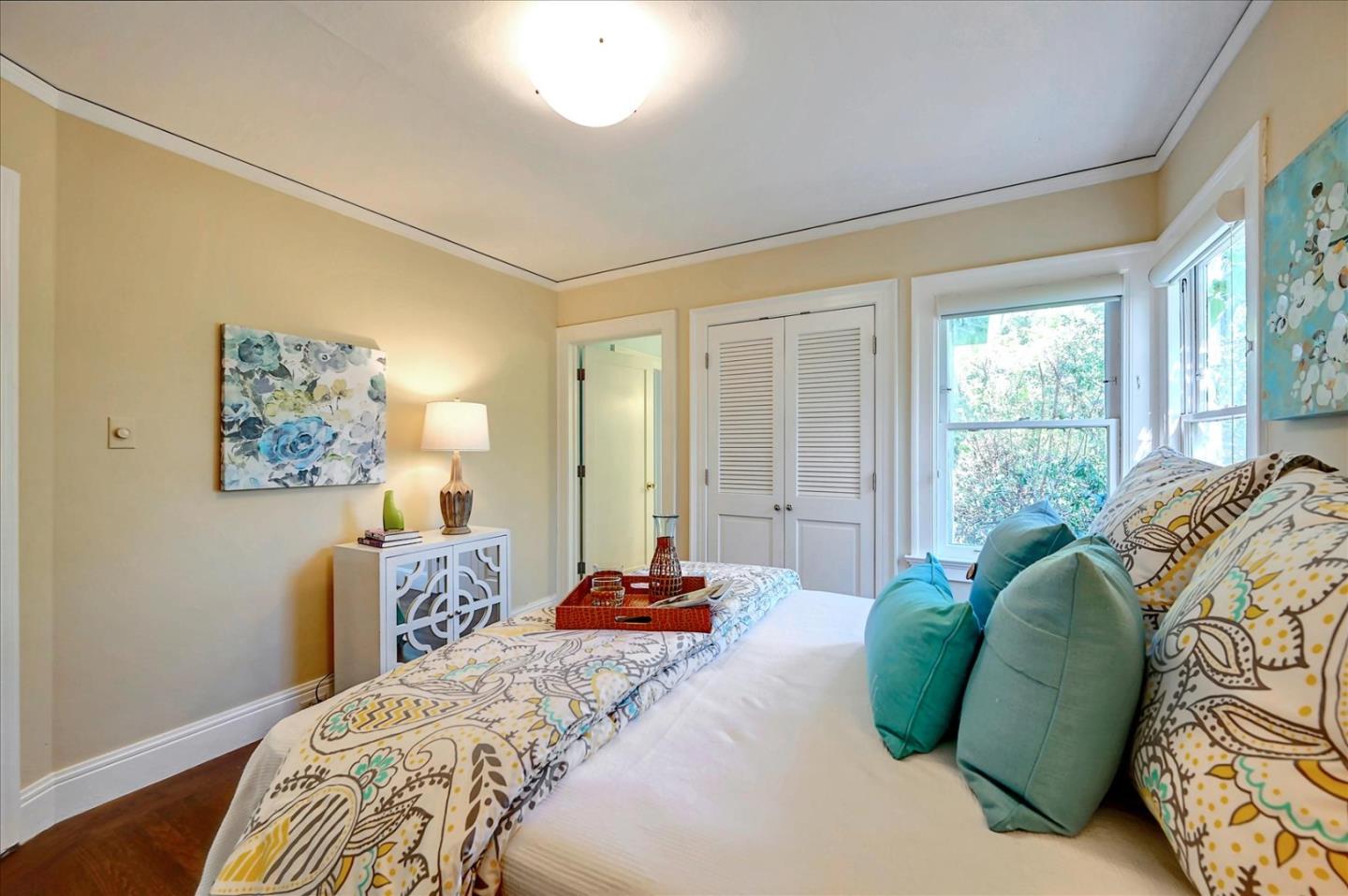 22 Engle Road San Mateo, CA 94402 - Photo 24 of 42 a bedroom with a bed and a painting on the wall