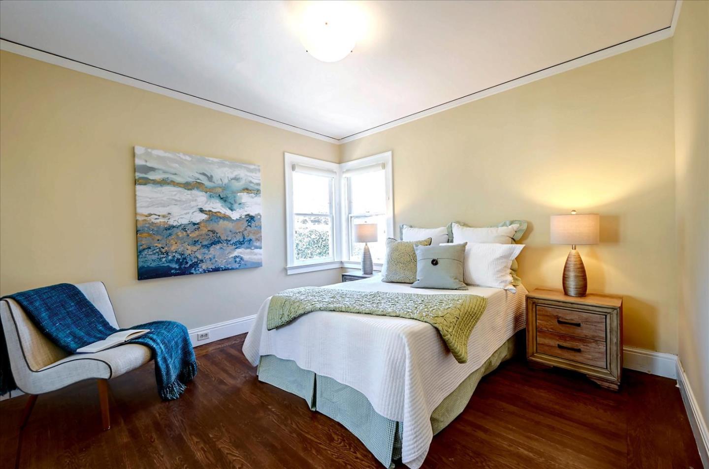 22 Engle Road San Mateo, CA 94402 - Photo 25 of 42 a bedroom with a bed and a painting on the wall