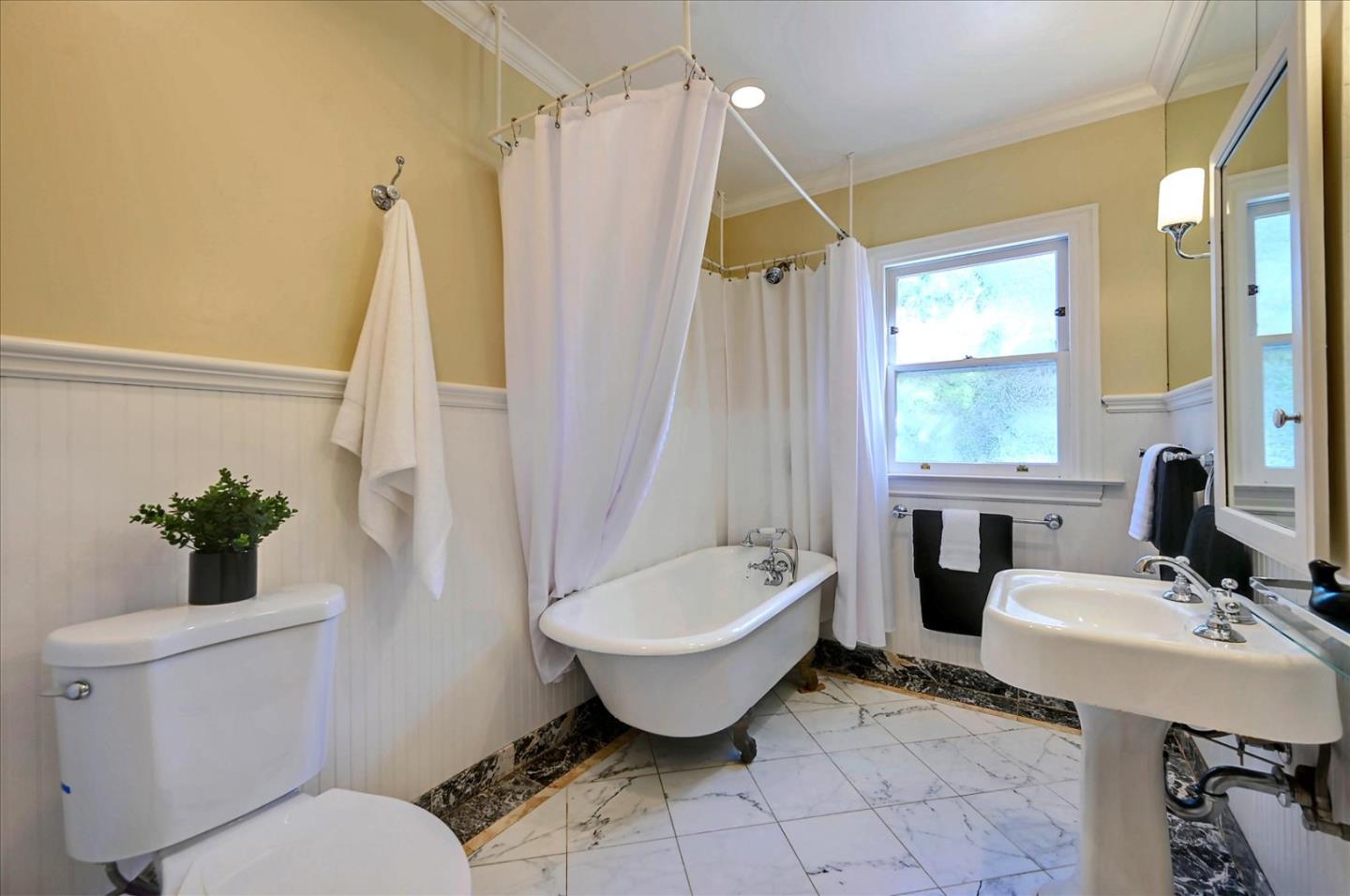 22 Engle Road San Mateo, CA 94402 - Photo 28 of 42 a bathroom with a sink toilet and shower