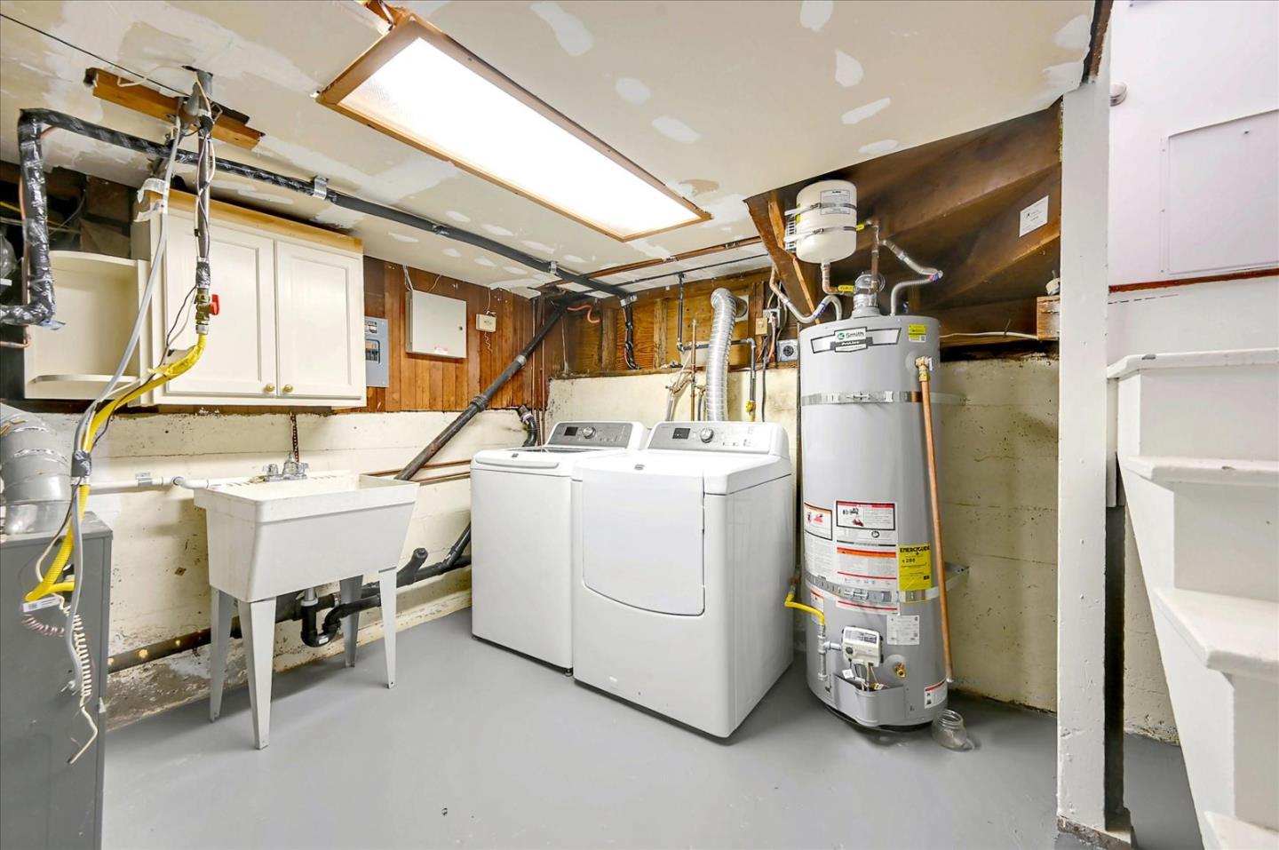 22 Engle Road San Mateo, CA 94402 - Photo 29 of 42 a utility room with dryer and washer