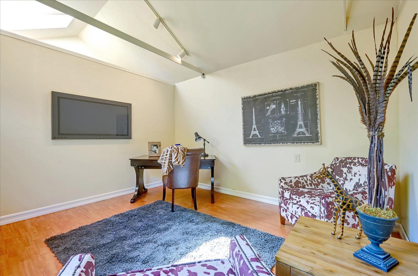 22 Engle Road San Mateo, CA 94402 - Photo 38 of 42 a bedroom with furniture and a wooden floor