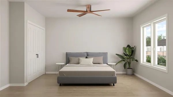 a bedroom with a bed and a window