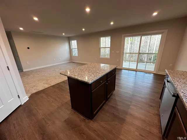 a kitchen with a refrigerator stove and microwave
