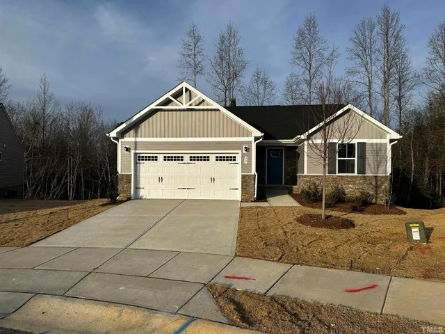 a front view of a house with garage