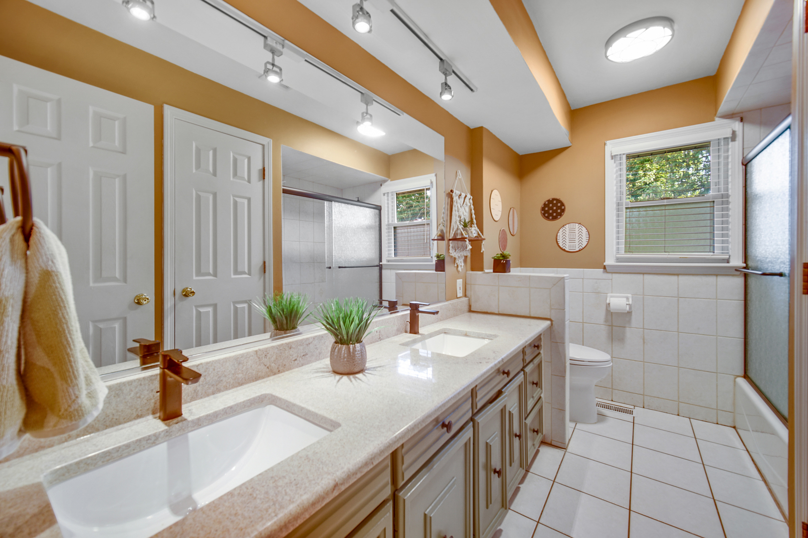 2296 185th Place Lansing, IL 60438 - Photo 12 of 32 a bathroom with a double vanity sink a mirror and a shower