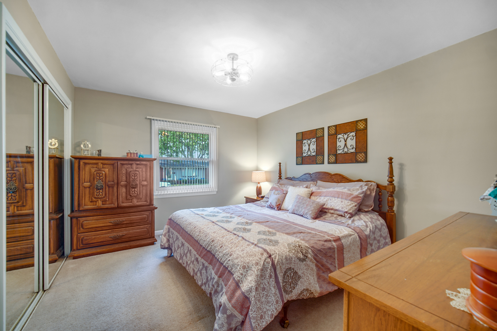 2296 185th Place Lansing, IL 60438 - Photo 14 of 32 a bedroom with a bed and a dresser