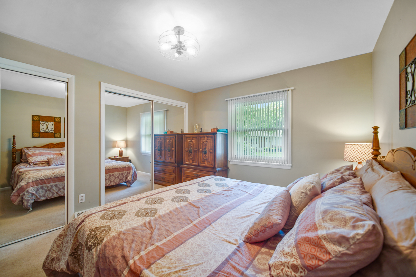 2296 185th Place Lansing, IL 60438 - Photo 15 of 32 a bedroom with a bed and a mirror