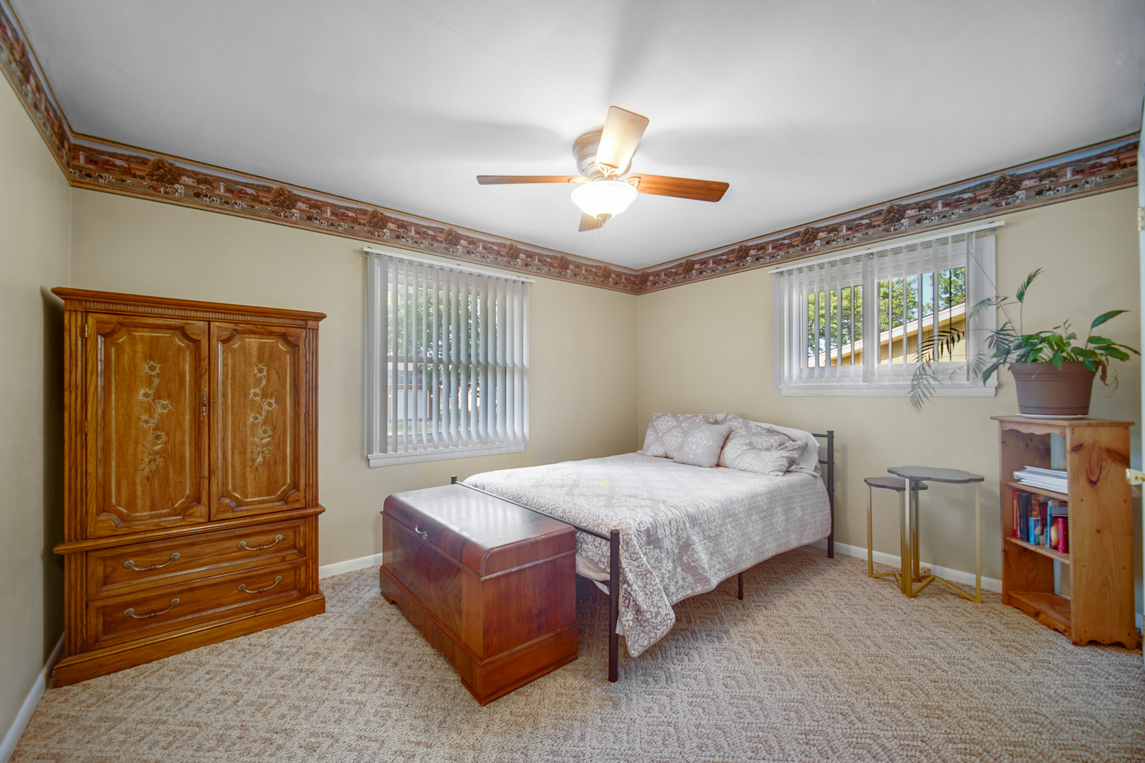 2296 185th Place Lansing, IL 60438 - Photo 16 of 32 a bedroom with a bed and a chandelier