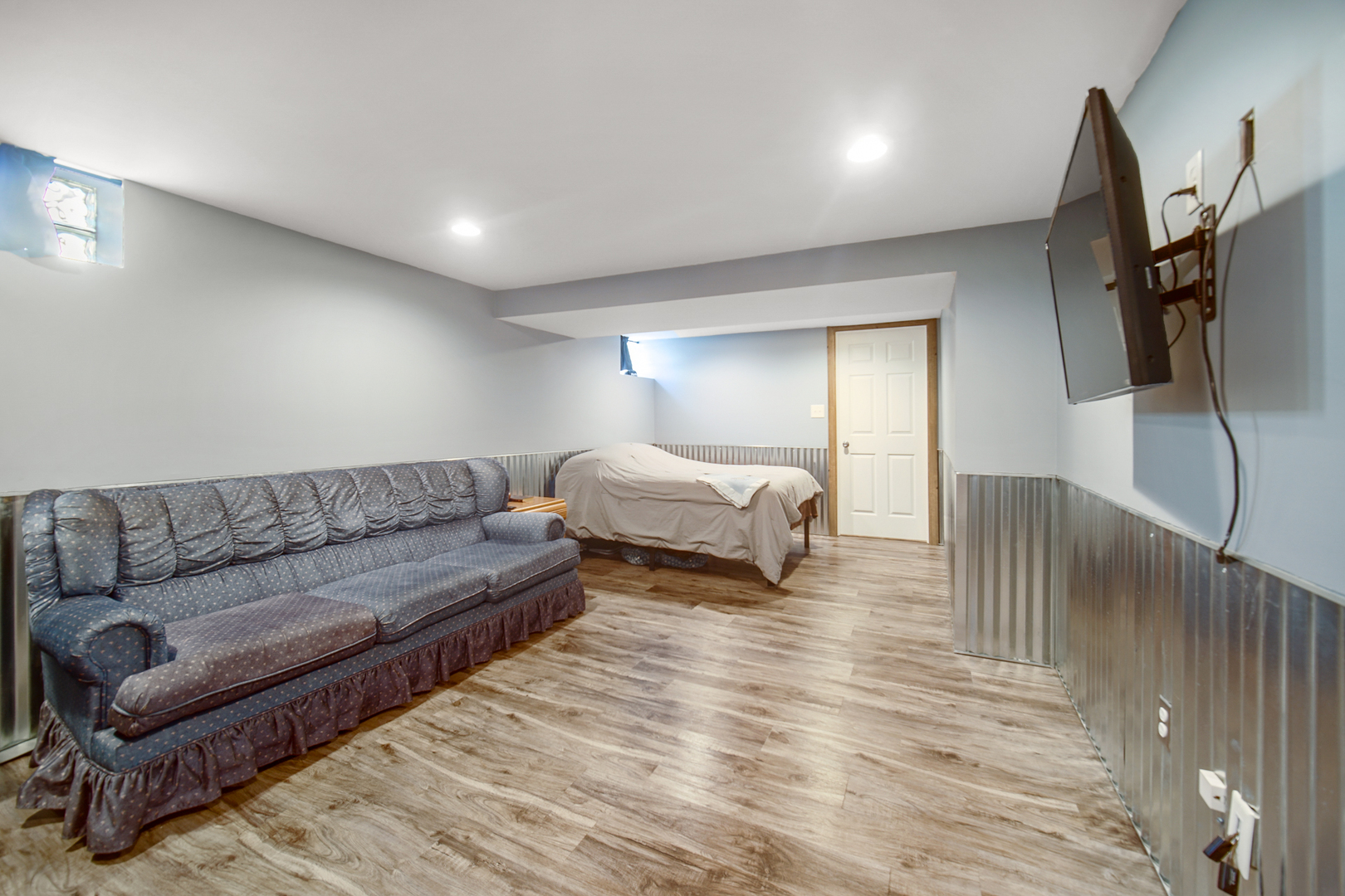 2296 185th Place Lansing, IL 60438 - Photo 20 of 32 a living room with furniture and a flat screen tv
