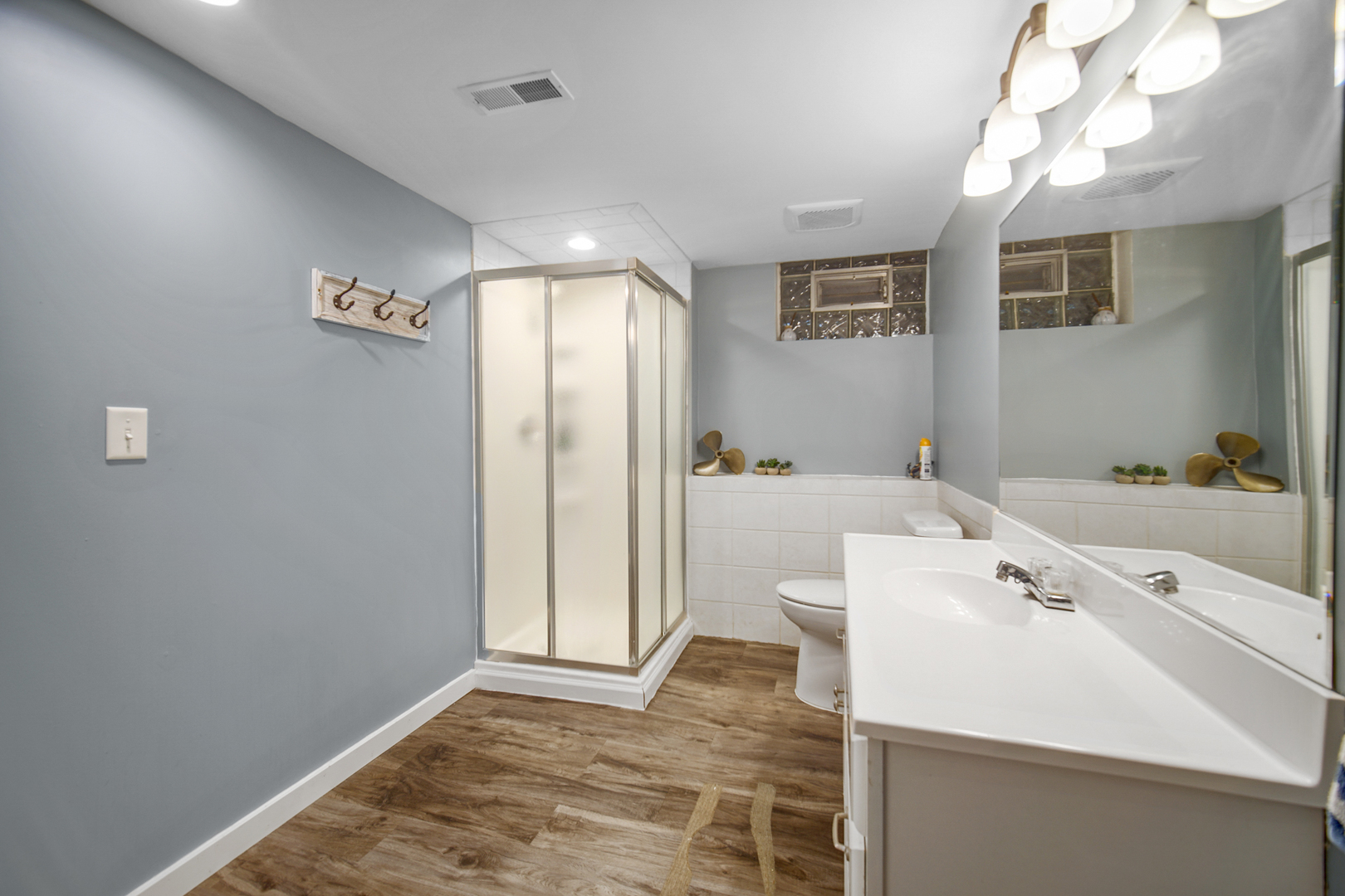 2296 185th Place Lansing, IL 60438 - Photo 21 of 32 a spacious bathroom with a sink a mirror and a shower