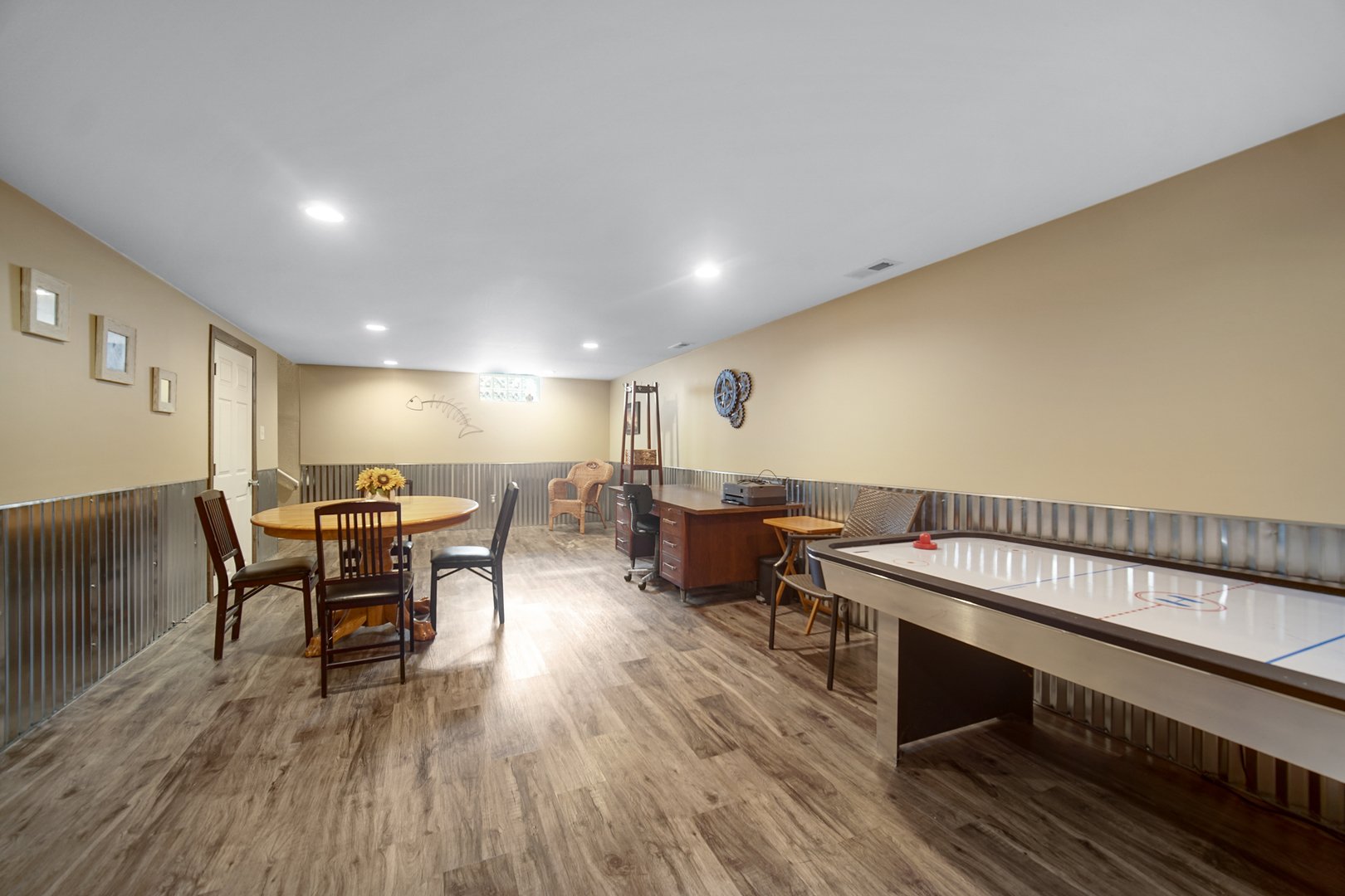 2296 185th Place Lansing, IL 60438 - Photo 25 of 32 a living room with furniture a dining table and wooden floor